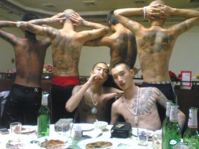 former leader of the Raza Unida prison gang, displays his gang tattoo,